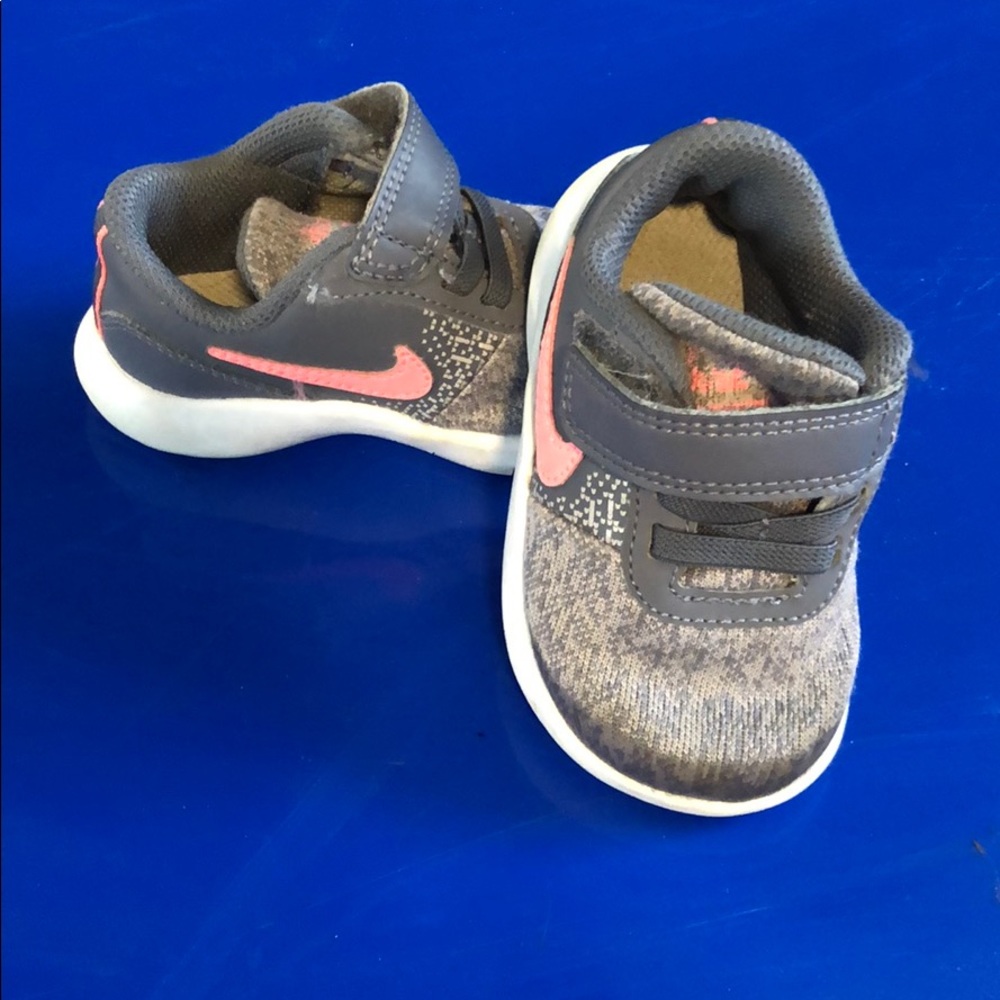 Grey and pink Nike baby shoes